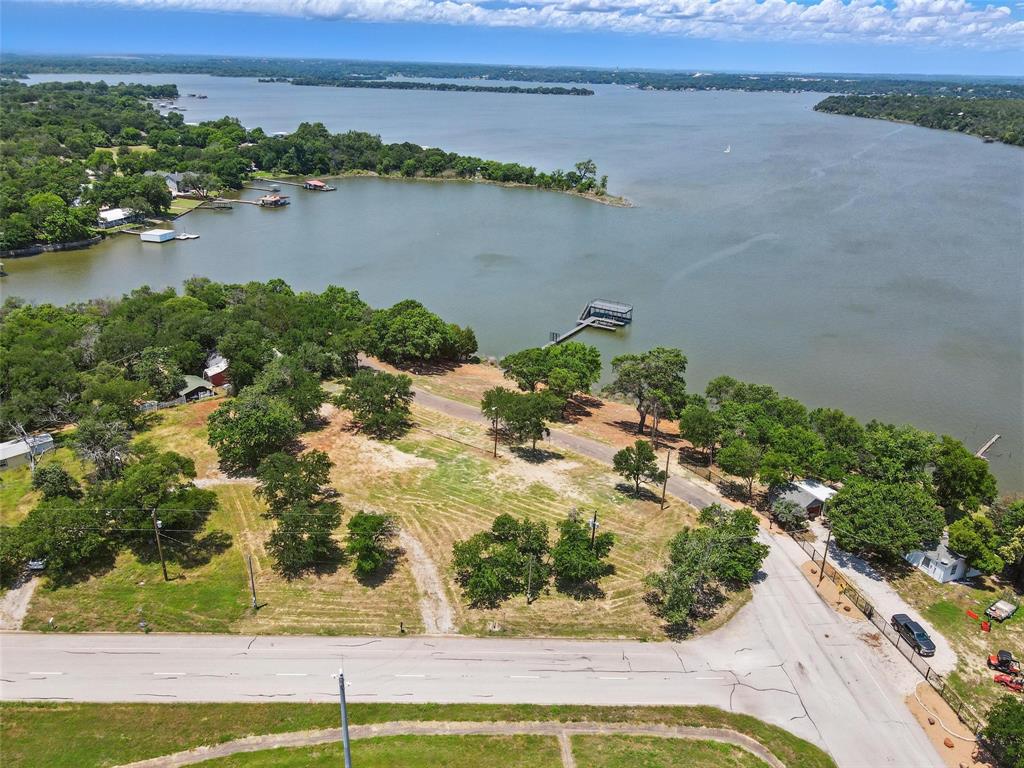 Looking for deeded waterfront property with an exceptional two-slip boat dock? Welcome to this beautiful building lots that are three lots packaged together.  All are perched on a gentle hill, offering stunning views of Lake Worth’s open water. This unique property includes deeded lakefront access and is ready for your dream home. Enjoy lake life to the fullest with a newly constructed dock featuring low-maintenance composite decking, two covered boat slips, jet ski lifts, and a spacious balcony—perfect for relaxing or entertaining with front-row seats to fireworks, the Joint Reserve Base Air Show, and even a peek at the downtown Fort Worth skyline. A secure storage closet on the dock keeps all your gear protected and organized. Spend your weekends grilling and gathering in the waterside pavilion, ideal for lakeside picnics and BBQs. Located just minutes from major highways, shopping, and only 15 minutes from downtown Fort Worth, this property offers the perfect balance of peaceful lakefront living and city convenience. The three lots have installed grinder pumps for three residences or you could replat for one larger parcel.  Come see the possibilities and enjoy the view!


Private Rmks: water front parcel is on permanent easements. The deed shows the right to use the land but you do not pay taxes or fees-so it is not a lease. Lot 39R1 with city parcel of 8508 Lot 39A 1 with dock. Both must be referenced on contracts. Deed Restrictions: 2,500 SF minimum Modern design Developer must approval of the design. The approval will not be reasonably withheld.