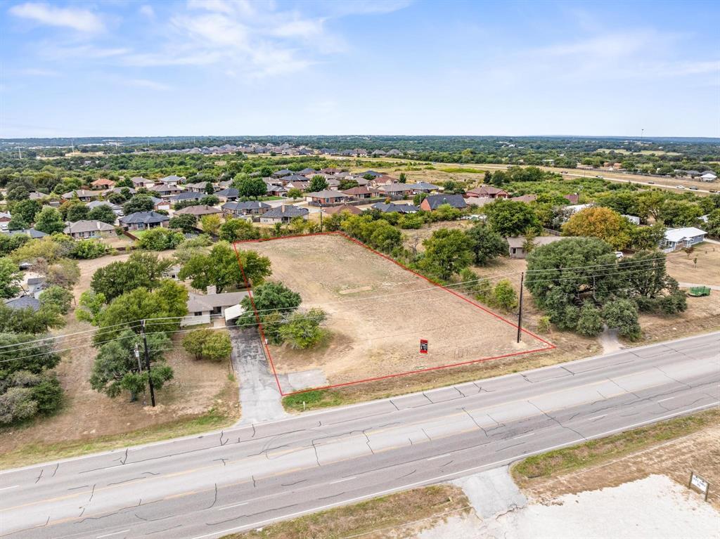 Prime commercial opportunity on highly traveled North Main Street in Weatherford! This one-acre tract is flat, cleared, and ready for immediate development, offering exceptional visibility and easy access for a wide range of business uses. The groundwork has already been done for you—featuring a brand new water well, available electricity with capacity for two meters, and completed TXDOT requirements. Driveway access off Main Street has already been approved, with plans available for review, saving valuable time and money in the development process. Positioned outside city limits, this property offers added flexibility and fewer restrictions, making it ideal for retail, office, service-based businesses, or investment use. Whether you're ready to build now or hold for future growth, this is a standout opportunity in a rapidly expanding area of Weatherford. TXT Lonestar3 to 88000 for instant info or to receive driveway plans.
