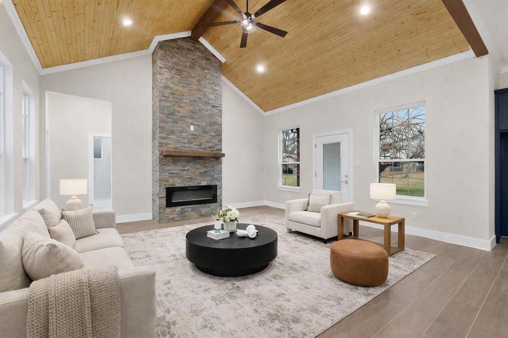 Stunning 3-bedroom, 2.5-bath modern farmhouse new construction featuring soft blue board-and-batten siding with stone accents and a welcoming covered porch.Close to Cedar Creek Lake with easy access to nearby marinas and boat ramps enjoy lake life just minutes away Inside, enjoy a bright open-concept layout with designer finishes throughout, including navy shaker cabinetry, quartz countertops, brushed gold fixtures, and a custom vent hood. The gourmet kitchen offers an oversized island, built-in stainless appliances, and modern lantern pendant lighting. The spacious living room is highlighted by vaulted ceilings with cedar detail and a dramatic floor-to-ceiling stone fireplace. Spa-inspired bathrooms feature quartz vanities, frameless glass shower, and elegant gold hardware. A perfect blend of farmhouse charm and contemporary luxury. Complete with a spacious 2-car garage and thoughtful craftsmanship throughout this home is truly a standout.