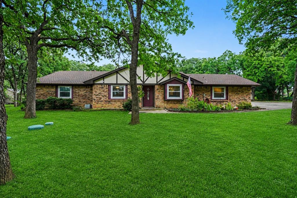 This 4-bedroom, 3-full-bath home delivers a rare dual primary suite layout, two bedrooms each with their own private ensuite bath, making it ideal for multi-generational living, long term guests, or simply the ultimate in household privacy. The kitchen features epoxy countertops that are as durable as they are sharp looking. The big ticket updates are already done, ROOF AND GUTTERS REPLACED 5 YEARS AGO, WATER HEATER REPLACED 3 YEARS AGO, and the ELECTRICAL BREAKER PANEL just 2 years ago. Buy with confidence knowing the major systems have been taken care of. Outside is where this property truly separates itself. A pergola with a hot tub sets the stage for year round relaxation and entertaining. Two storage buildings give you the extra space most properties simply can't offer, perfect for tools, equipment, hobbies, or overflow storage. The lot itself, with its canopy of mature trees, gives the entire property a serene, tucked away feel that's rare at any price point. Zoned to Keller ISD with nearby schools including Ridgeview Elementary, Trinity Meadows Intermediate, and Trinity Springs Middle School, one of the most highly regarded school districts in North Texas. Easy access to I-35W, Hwy-377, and Hwy-114 puts Fort Worth, Dallas, and DFW International Airport all within a short drive. Alliance Town Center is just minutes away for dining, shopping, and entertainment, and the thriving North Fort Worth corridor has everything you need close by.  A private retreat with the right address and the updates to back it up. Schedule your tour today!  Discounted rate options and no lender fee future refinancing may be available for qualified buyers of this home.