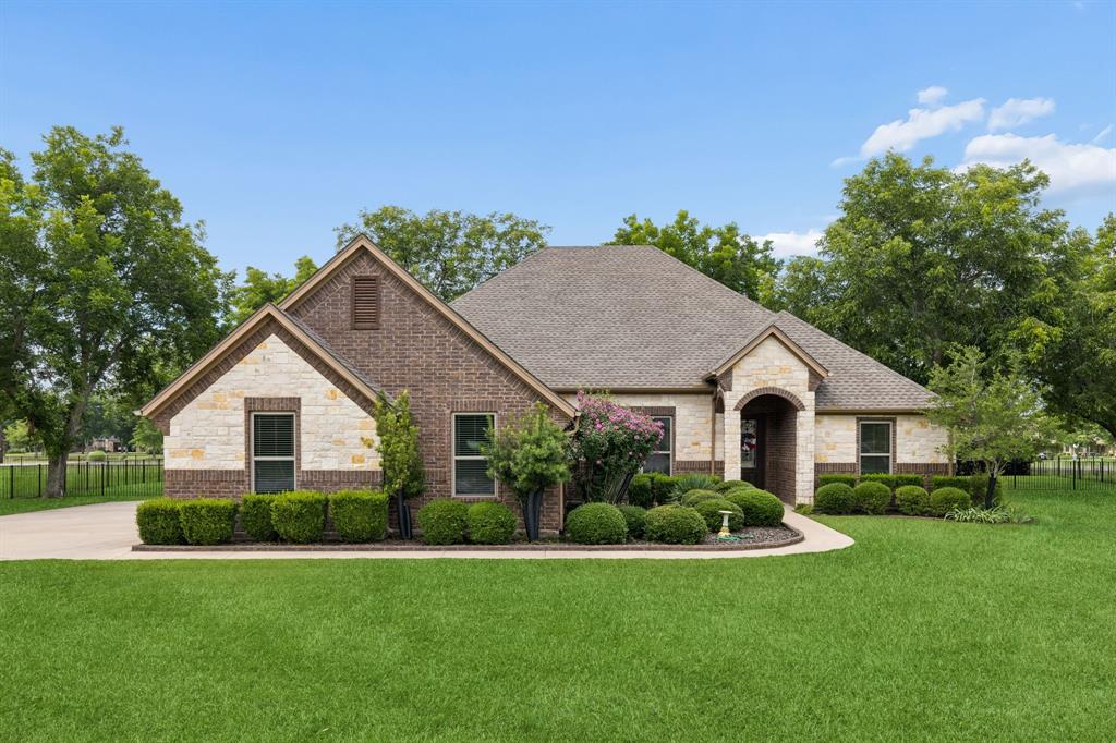 Located in the Orchard section of Pecan Plantation in Granbury Texas in Hood County & zoned to Granbury ISD, this 4 bedroom, 2 full bathroom custom home offers approximately 2,361 sqft of single story living on a landscaped 0.59 acre lot shaded by mature pecan trees. The location provides convenient access to Historic Downtown Granbury, Lake Granbury, shopping, dining & recreation while enjoying one of North Texas' premier gated golf course communities near Lake Granbury. Buyers exploring homes in Pecan Plantation in Granbury Texas may appreciate the combination of privacy, mature landscaping, golf cart accessibility, resort-style amenities & an active lifestyle centered around golf, lake recreation & community events. If you are searching for 4 bedroom homes in Granbury Texas within Granbury ISD, the layout offers an open design with engineered wood flooring, crown molding, custom cabinetry, natural light & a spacious living area anchored by an Austin stone gas fireplace. The kitchen features granite countertops, center island, gas cooktop, electric oven, pantry & generous cabinet storage. The primary suite includes dual vanities, garden tub, separate shower & a large walk-in closet with utility room access. The fourth bedroom provides flexibility for guests or a dedicated office. Recent improvements include a Class 4 impact-resistant roof, replacement windows, updated HVAC system, water heater, gutter guards & spray foam insulation. Outdoor living includes a covered patio, patio extension, custom pergola, iron fencing, sprinkler system & privacy hedges creating a peaceful outdoor setting. The oversized garage includes dedicated golf cart storage, and residents enjoy access to golf, marina access, pools, tennis, pickleball, parks, trails, clubhouse dining, equestrian facilities & 24-hour gated security. This property offers a strong combination of updates, outdoor living & lifestyle amenities within the Granbury Texas market.