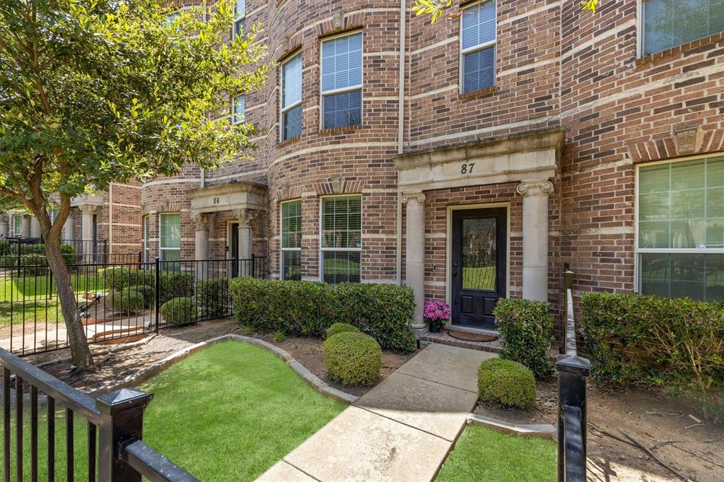 Welcome to 2500 Rockbrook  Drive, Unit 6C-87, in the desirable Brownstones at Vista Ridge. This beautifully maintained 3-bedroom, 2.5-bath townhome offers true lock-and-leave convenience with abundant green space just outside the front of the home. Designed for comfortable living and effortless entertaining, the second level features hardwood floors throughout the living, dining, and kitchen areas. The spacious living room is anchored by an electric fireplace and flows seamlessly into the well-appointed kitchen, complete with alder wood cabinetry, granite countertops, a large center island, and generous storage. The expansive primary suite provides a private retreat with a sitting area, a spa-inspired bath featuring a jetted tub, separate shower, and a large walk-in closet. Two additional bedrooms offer flexibility for family, guests, or a home office.  A two-car attached garage adds convenience, while the exceptional location places you just minutes from shopping, restaurants, and everyday amenities. Enjoy low-maintenance living in one of the area's most convenient communities, with the added benefit of a move-in-ready package that includes the refrigerator, washer, and dryer.
