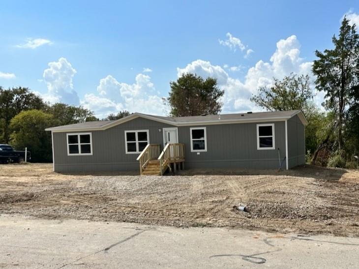 Newly Constructed Home Priced Below $200,000! This 4-bedroom, 2-bathroom Clayton home, built in 2023, is eligible for FHA financing and sits on a spacious lot with no HOA or deed restrictions. Notable features include a rear deck accessible through a sliding glass door, no carpet, and it's ready for you to move in, complete with a brand-new refrigerator. The septic system is also brand new and includes a prepaid 2-year maintenance contract. The foundation is engineered to meet HUD specifications. This home offers the convenience of proximity to restaurants, shopping centers, and major highways. Act fast on this opportunity, as homes like this tend to sell quickly. Don't miss your chance to make this remarkable property your own; schedule a viewing today and take a step closer to affordable homeownership!