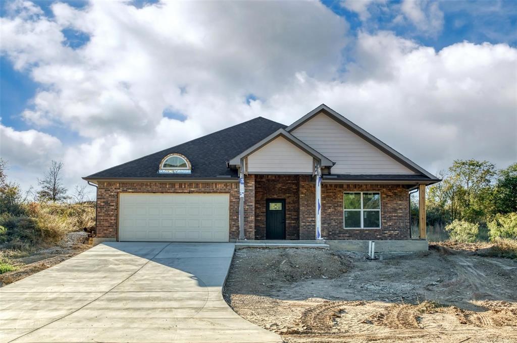 Incomplete-New construction foreclosure near Lake Bridgeport-priced aggressively and sold AS-IS. This 3 bedroom, 2 bathroom home is approximately 1850 sq ft in Runaway Bay, it offers a modern open-concept design, split-bedroom layout, and a fantastic location close to Lake Bridgeport. Experience what this lake has to offer, boating, fishing and outdoor recreation. The home is approximately 90% complete. All photos show current condition of the property. Remaining items to be finished include dishwasher, electric range, microwave, electric water heater, outside AC condenser unit, primary bedroom flooring, primary shower, second bath tub surround, faucets, electric fireplace in living room and some lighting. Exterior needs landscaping, leveling and retaining wall rebuilt. Cash is recommended due to the Incomplete items.
