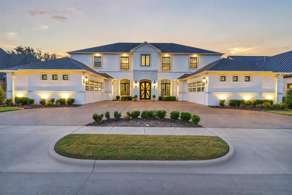 There are luxury homes… and then there are homes that define a market.

Perfectly positioned on the 1st fairway of Harbor Lakes Golf Club, this gated Georgian estate is one of Granbury’s most remarkable residences. With 6,000+ square feet, six bedrooms, four and a half baths, dual laundry rooms, a resort-style backyard, and a 4.5 car garage, the home delivers a standard of design rarely found in Hood County.
Its symmetrical façade, cast stone architecture, and commercial windows create an exterior that will remain timeless for generations. Inside, soaring ceilings, warm hardwoods, abundant natural light, and solid core doors elevate every space, with precision sound proofing in key areas for comfort and privacy. The lighting reads like curated jewelry, with each fixture chosen to define a magazine-worthy masterpiece.
Built for hosting at scale, the expansive layout sleeps 20+ guests, creating an environment for celebrations, extended stays, and gatherings of any size. The kitchen serves as the centerpiece, offering custom cabinetry, porcelain finishes, premium appliances, and an oversized island beside a dining space suited for large dinner parties.
The second level feels like a boutique hotel with four bedrooms, two baths, a second laundry, and a combined game and bunk room. The backyard frames hole one and opens to panoramic views of the 9th and 18th greens, the clubhouse, and Comanche Peak, with a picturesque pool and spa creating a postcard-worthy retreat.
Harbor Lakes’ exclusive gated main body boat ramp sits just seconds away, offering a smooth connection to the lake. It’s a rare blend of golf course living and lake convenience, paired with square footage and privacy that are exceptionally hard to find.
Located minutes from the Historic Square, where evenings unfold with dinner and entertainment in the charming district—voted Best Historic Small Town in America. This home captures the essence of the very best living in Granbury’s Resort Town.