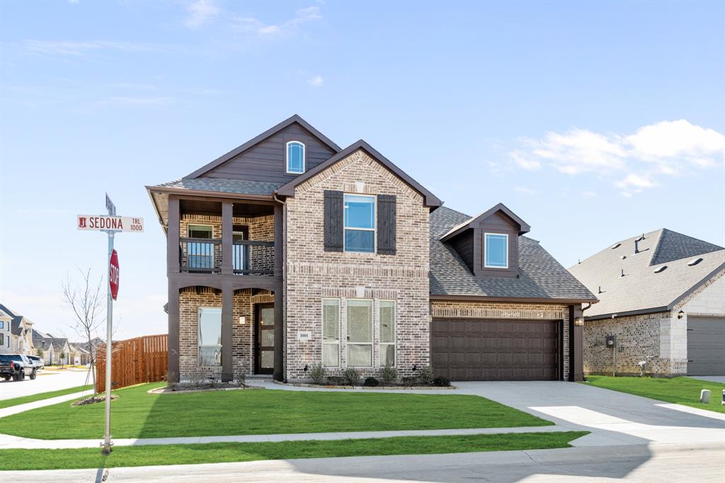 NEW! NEVER LIVED IN. Quick Close Ready! The Magnolia II by Bloomfield Homes is a beautifully designed 5 bedroom, 4 bathroom home with a 2-car garage, perfectly placed on a corner lot in the highly sought-after Timberbrook community. Step inside to soaring ceilings, 8' interior doors, and site-finished wood floors throughout the main living areas. The spacious Family Room is anchored by a striking tile-to-ceiling fireplace with a gas starter and cedar mantel, bringing warmth and character to the heart of the home. The Deluxe Kitchen is a dream, featuring quartz countertops, double ovens, a 5-burner gas cooktop, custom cabinetry with plenty of storage and prep space. The open flow leads you seamlessly from the kitchen into the light-filled breakfast nook and out to the large covered patio, perfect for entertaining. Upstairs, you’ll find a Game Room, Media Room, and secondary bedrooms, including one with its own private full bath—perfect for guests or multigenerational living. The balcony adds both style and function, offering a great spot to take in elevated views. The Primary Suite is located downstairs for privacy and includes a spa-like bath with upgraded finishes, dual vanities, a soaking tub, and a separate shower. Enjoy outdoor living year-round with both a covered front porch and an extended covered back patio, complete with gutters, upgraded lighting, and a gas stub for grilling. Located in Timberbrook, residents enjoy resort-style amenities including a pool, pickleball, volleyball, scenic walking trails, and more. The Magnolia II by Bloomfield Homes has it all—style, space, and an unbeatable location. Don’t miss your chance to call it home, Visit Bloomfield at Timberbrook today!