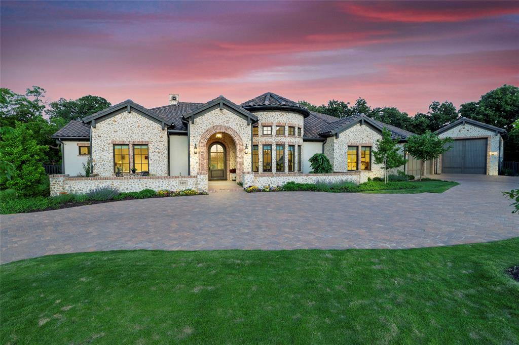 Back on the market, more than $75k under appraisal,  and better than ever—this custom SCH luxury home in Southlake’s gated Stony Brook community delivers the lifestyle everyone wants but few ever find. With four ensuite bedrooms, a showstopping open living*kitchen design, and a private backyard retreat, this home checks every box. The kitchen is built to impress: an oversized Quartzite island, eat-in layout, and a fully outfitted prep kitchen with Wolf appliances and a warming drawer. Entertain in style in the separate dining room or take the party outdoors to the heated pool, spa, fire pit, and covered patio with a full Coyote outdoor kitchen. The garage setup is unmatched—three deep bays with two EV chargers, plus a fourth bay with a full bath and room for a 30' camper. Whether you’re a traveler, collector, or hobbyist, this space adapts to your lifestyle. Smart-home automation, owned solar panels with a transferable warranty, and access to Keller ISD with Carroll ISD open enrollment round out this exceptional offering. 
Luxury, privacy, and functionality—this home delivers it all.