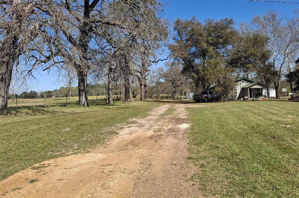 Take a look at this 68.82-acre property with a great mix of woods and pasture. Located in the sought-after Jacksonville ISD, it includes a 2-bedroom, 1-bath house of about 1,200 square feet, which is currently occupied. The land also has several ponds and different pastures. This is a great chance for anyone wanting to build a homestead for multiple generations, enjoy nature, or create their ideal property. You can experience the quiet of country living while still being close to restaurants, shopping, hospitals, and entertainment. The property is just 5 minutes from Jacksonville, 30 minutes from Tyler, and a little over 2 hours from Dallas, making it a good fit for both full-time living and weekend visits. There are many ways to use the land, whether for a home, recreation, or farming. Imagine building your custom house or barndominium, setting up a place for several families, or creating a peaceful retreat for hunting and wildlife. You can also bring your animals and start a garden or homestead. There are so many possibilities here