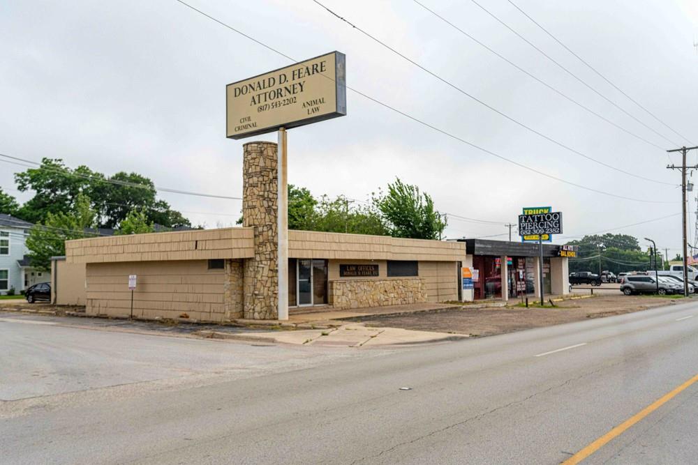 Located in the heart of Arlington, this commercial property is a versatile usable space perfect for many types of business - zoned DNO-GC. Visible and accessible off Division just west of Cooper, it provides potential for ideal business presence. The building comprises of 2 units or can be a large single unit. Several office spaces, conference rooms, storage, a handy full kitchen in the center of the property, his and hers bathrooms, reception area, full bathroom off the main office and room to provide a sitting area create functionalility. Parking is ample located in the front, side and back of the building. With the City of Arlington's revitalization initiative, this is a perfect investment for muliple commercial uses.