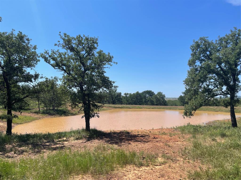 180 Acre Prime Recreational & Hunting Ranch Full of Oak Trees in Jack County*Great Cattle Ranch as well*Ag Exempt*2022 3 Bedroom, 2 Bath Manufactured Home with Electric & a 300 Ft. Well for Water, 1620 Sq. Ft., Front & Back Decks to watch the sunrise & sunsets*Fully Furnished with Refrigerator, Washer & Dryer, Furniture*Aerobic Septic*Barn with piers to store things or use as a Workshop*Elevation Changes up to 200 ft.*Live Creek*1 Pond, 12-15 ft. Deep*2 other potential areas for Large Ponds*Cattle Pens*Deer, Turkey, Hogs*No Oil & Gas Production or No Windmills on Ranch besides 1 Gas Pipeline*2 Deer Blinds, 2 Corn Feeders, 1 Protein Feeder are Negotiable*Property is right off of HWY North 281*Hour and a half from the Metroplex