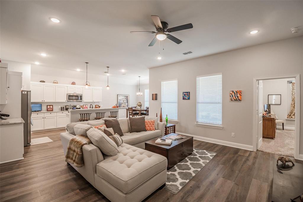Move-in ready 2021 modern brick home with extensive upgrades and thoughtful design throughout, ideally located approximately 10 minutes from Downtown Dallas and the Bishop Arts District.
A grand foyer with decorative chandelier welcomes you into an open-concept floor plan featuring luxury vinyl plank flooring, recessed can lighting, dimmer switches throughout much of the home, an electric fireplace, and a spacious living area designed for everyday comfort and entertaining.
The kitchen offers modern appliances, abundant cabinet and counter space, a large island with stainless steel sink, walk-in pantry, and butler’s pantry. A separate mudroom and utility room provide added convenience and functionality.
The spacious primary suite includes dual sinks, a large walk-in shower, and an oversized walk-in closet. Three additional bedrooms feature ceiling fans and ample closet space. Driveway large enough to accommodate another car to park on side drive and not block garage, so ample parking. 
Unlike many new construction homes, this property already includes thousands of dollars in completed improvements, including a WiFi-enabled Rain Bird sprinkler system, approximately $4,000 security system with smoke detection, blinds throughout, ceiling fans in every bedroom, leaf guard gutters, landscape lighting, and a 7-foot stained cedar privacy fence.
Covered front and rear patios extend the living space outdoors, complemented by an oversized garage and attic walkway offering valuable storage options. Lawn equipment may convey with an acceptable offer.
Convenient access to dining, shopping, entertainment, and major employment centers makes this location highly desirable. Move in and start enjoying the benefits of homeownership without the added expense of completing post-closing upgrades.
Property qualifies for a grant program offering $17,500 in assistance, including 3% down payment support and $7,500 toward closing costs.