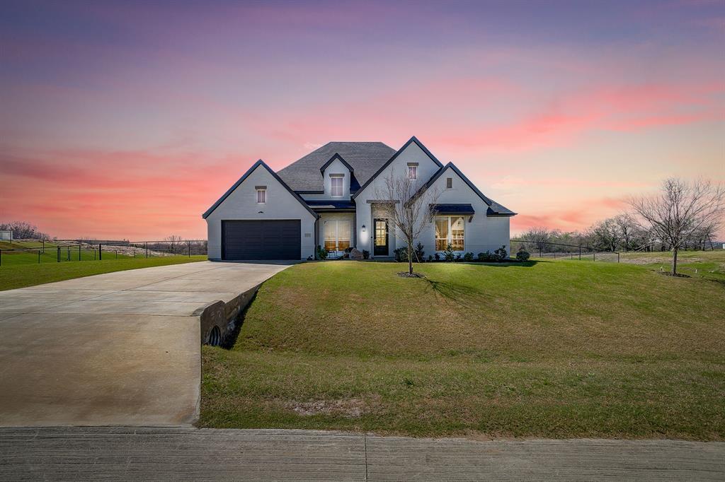 Finally, a home that truly has it all without compromise. With 4 bedrooms, a dedicated office and a game room, this beautifully designed 2022 built residence offers a thoughtfully crafted layout that balances space, comfort and functionality. Designed with a split bedroom floor plan, the home provides privacy while maintaining inviting spaces for gathering and entertaining. The heart of the home is the impressive open concept living area, where soaring floor to ceiling windows and a welcoming fireplace create a warm and inviting atmosphere. The living room flows seamlessly into the well-appointed dining room and kitchen featuring a large center island, gas range, expansive pantry and abundant counter space, ideal for both everyday living and hosting guests. The spacious primary suite serves as a private retreat, complete with an ensuite bathroom and a thoughtfully connected primary closet that leads directly into the laundry room, simplifying daily routines and adding an extra layer of convenience. The split bedroom design ensures comfort for all. Two secondary bedrooms share a full bathroom, while the fourth bedroom enjoys its own dedicated bathroom, which also serves as a convenient guest bath. Additional highlights include a three-car garage, offering ample space for vehicles, storage or hobbies. Situated on one of the largest lots in the neighborhood, the property features a fully fenced backyard with plenty of room for outdoor living, recreation or future enhancements. Ideally located just minutes from Azle with an easy drive to Fort Worth, this home offers the perfect balance of peaceful neighborhood living and convenient access to city amenities. Seller is offering a $10K buyer credit to be used for closing cost or interest rate buy down.