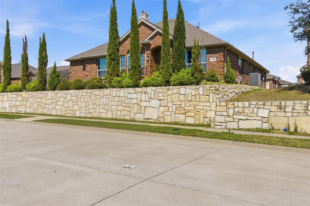 Beautiful one-story home on a corner lot featuring marble flooring throughout. All bathrooms include traditional marble walk-in designs with bathtubs. Open-concept modern kitchen flows into a spacious family room and offers abundant cabinetry with double pantries. Private mother-in-law suite with its own entrance, full kitchen including dishwasher, gas oven and range—ideal for extended family or guests. Large backyard with covered patio and outdoor kitchen, plus ample parking. Conveniently located near PGB Turnpike, Hwy 75, and I-635, and within walking distance to elementary, middle, and high schools.