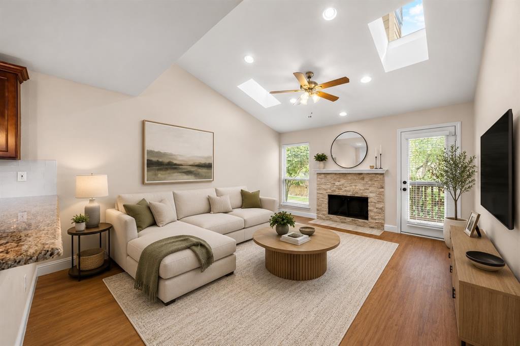 MOTIVATED SELLER! Experience upscale living in this beautifully remodeled, light-filled upstairs condo located just minutes from Addison, the Galleria and the Dallas North Tollway. This one-of-a-kind 1-bedroom, 1-bath was completely remodeled in 2016. It was taken down to the studs and the difference it makes in the look and feel of the property is noticeable.  It's a perfect blend of luxury, convenience, and style within a quiet gated community. The open-concept floorplan showcases luxury wood-look vinyl plank flooring, brand-new carpet, an abundance of natural light and a striking stacked stone fireplace that creates a warm and inviting atmosphere. The spacious kitchen features granite countertops, an abundance of cabinets, generous prep space, and flows seamlessly into the living and dining areas, making it ideal for everyday living and entertaining. The beautifully updated bathroom includes stylish designer finishes and a modern tile shower surround, while the oversized bedroom offers a full wall of closet space.  Refrigerator, washer, and dryer are included as well as a secure one-car garage conveniently located directly below the unit. Residents enjoy access to two sparkling pools and an outdoor kitchen area, all while being within walking distance to Whole Foods, Trader Joes, shopping, dining, and entertainment. This move-in-ready condo offers an unbeatable lifestyle in an exceptional location. NEW Windows 2026, AC 2021, water heater 2022.Come see!