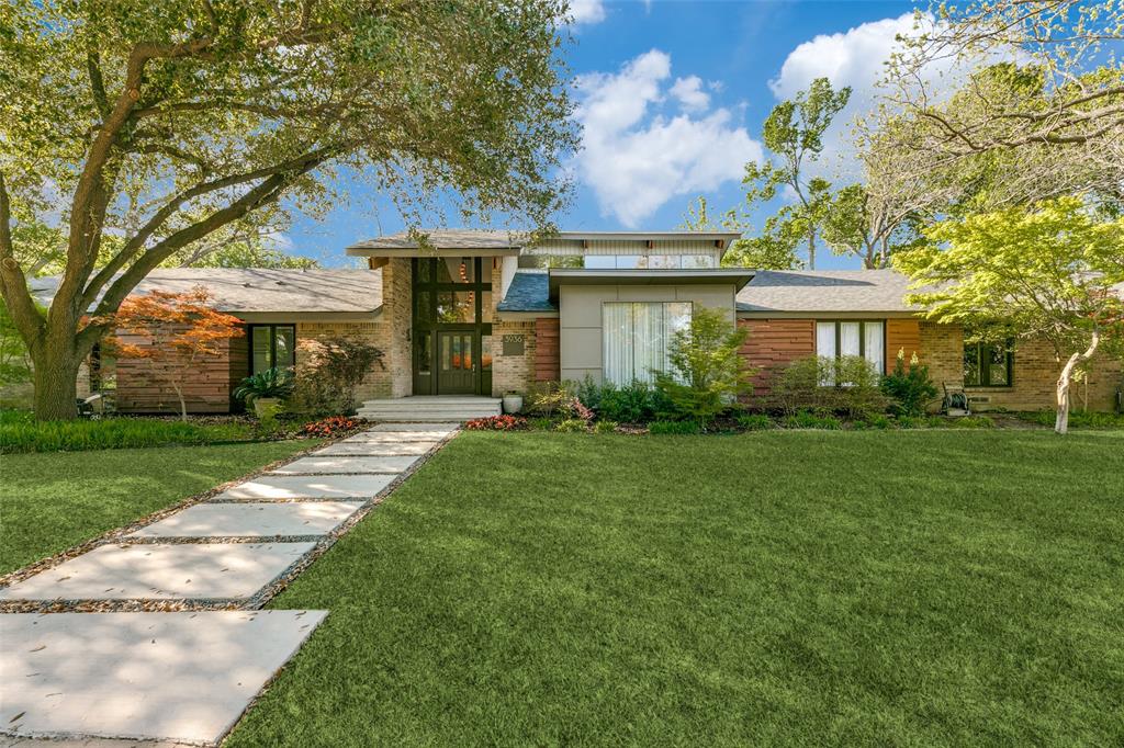 This spectacular updated mid-century home overlooks a beautiful spring fed creek with almost three quarters of an acre of park like landscaping and mature trees.  The open concept living space and kitchen with their large expanses of glass allow an abundance of natural daylight and provide stunning views of the creek and wildlife. With vaulted ceilings, beautiful wood floors, and a large wet bar with refrigerator freezer, ice maker, and wine fridge, this house is perfect for entertaining. The bonus sunroom has beautiful views of the creek with operable doors and screens and built in grill. The extraordinary gourmet kitchen features top of the line appliances with custom made Italian lacquer cabinets featuring two separate work islands with sinks.  The primary bedroom suite has its own glass sitting area overlooking the creek, extra large closet, generous vanities plus modern shower and tub. The oversized two car garage has an adjacent workshop and generous storage closet.