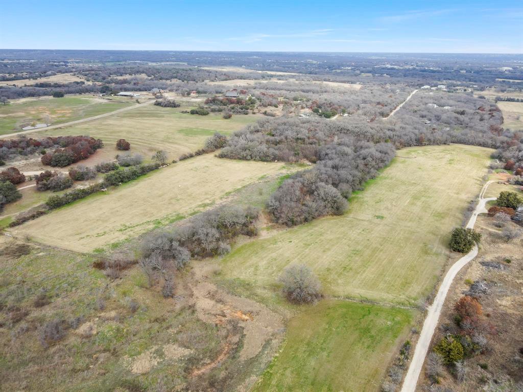 Prime opportunity in the heart of Azle!  27.168 acres of beautiful Texas land with open space, tree-lined areas, and a tank.  This location that offers exceptional visibility and future potential, and is ag exempt, partially wooded, and has no known restrictions, making it ideal for agricultural, residential, commercial, or investment use. Conveniently located directly across from Hilltop Elementary with access from FM 730, this prime tract offers the rare combination of usability, location, and flexibility that is hard to find. Whether you envision a private estate, development opportunity, business use, or long-term land investment, this property and it’s beautiful setting has endless potential and is well suited for a wide range of future uses. Don’t miss your opportunity to own this rare find in Parker County.  See documents for more information. Listing agent and broker not responsible for any inaccurate information. Buyer and Buyer's agent to verify all information.  Location not accurate in maps.  Property is located directly across FM 730 S from Hilltop Elementary.