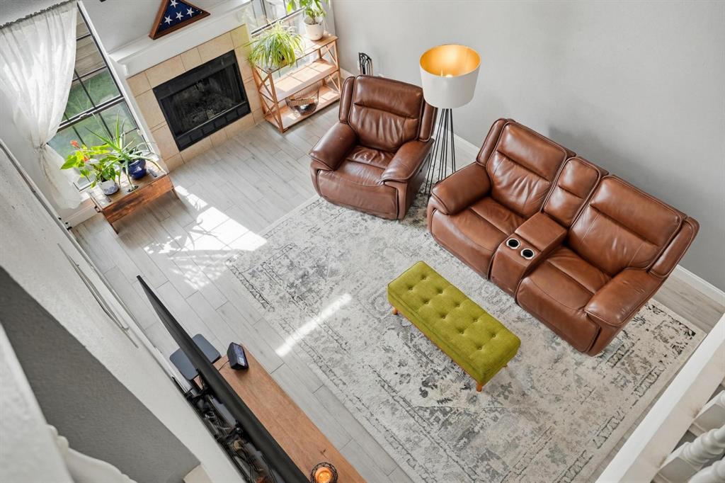 This beautifully updated townhome offers the perfect blend of comfort, style, and low-maintenance living. A spacious foyer welcomes you into the bright living area featuring vaulted ceilings and a cozy wood-burning fireplace. The updated kitchen is designed to impress with quartz countertops, a farmhouse sink, soft-close cabinetry, and abundant natural light from both a skylight and large window. The primary suite is conveniently located on the first floor and includes private patio access, ideal for relaxing or grilling outdoors. The backyard features artificial turf for year-round beauty with minimal upkeep. Additional highlights include 2 covered parking spaces, new roof, new AC ductwork, and low-maintenance exterior living.

Residents enjoy beautifully landscaped common areas, a community granite in-ground pool, and access to a nearby clubhouse available for private events with a refundable deposit. HOA fees cover all exterior maintenance. landscaping, water, sewer, and trash services, plus the community amenities.

Ideally located just north of Arlington and adjacent to DFW Airport, this home provides quick access to DFW and surrounding areas via major highways. Enjoy being minutes from shopping, dining, and entertainment while still enjoying the comfort of a welcoming community atmosphere.

Perfect for first-time homebuyers, downsizers, or anyone seeking convenient, carefree living. Don’t miss this well-maintained gem!