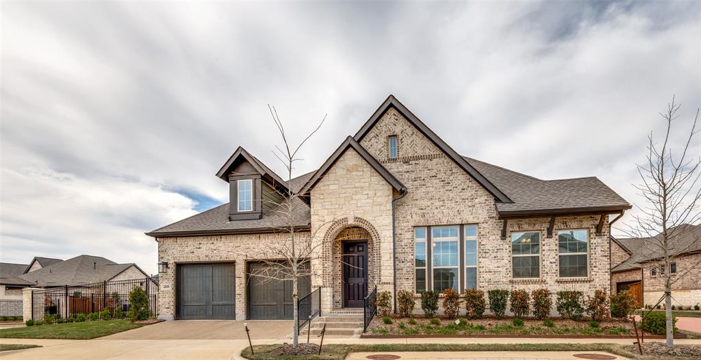Located on an oversized premium corner lot in the highly sought-after Viridian active adult community in Arlington, this stunning Brooklyn floor plan by David Weekley Homes showcases approximately $75,000 in thoughtful upgrades and elevated design throughout.  Designed with both comfort and style in mind, the open-concept layout features sliding patio doors that seamlessly connect indoor and outdoor living. The extended patio creates the perfect space for relaxing or entertaining, while exterior flood lighting enhances both ambiance and security.  At the heart of the home, the upgraded kitchen is a true standout, featuring cabinetry extended to the ceiling with glass inserts and integrated lighting, a wrapped island, and elegant dolomite countertops. A premium appliance package includes a GE Cafe 36 inch stainless steel vent hood, GE Cafe cooktop, GE wall oven, and GE Profile dishwasher.  The primary suite offers a private retreat with a stylish barn door entry into the bathroom, where you’ll find tile extending throughout the bath and closet areas, a fully tiled walk-in shower to the ceiling for a seamless finish, framed mirrors, and upgraded dolomite countertops.  The guest bathroom has also been enhanced with a frameless glass shower door, upgraded tile, countertops, and framed mirrors.  Additional features include Levolor blinds throughout, an epoxy-coated garage floor, extended 24 x 14 patio, and a well-equipped garage with dedicated 30 AMP service and refrigerator plug.  Situated within Viridian, residents enjoy a vibrant, amenity-rich lifestyle with access to walking trails, lakes, community events, and more...all in a premier Arlington location.