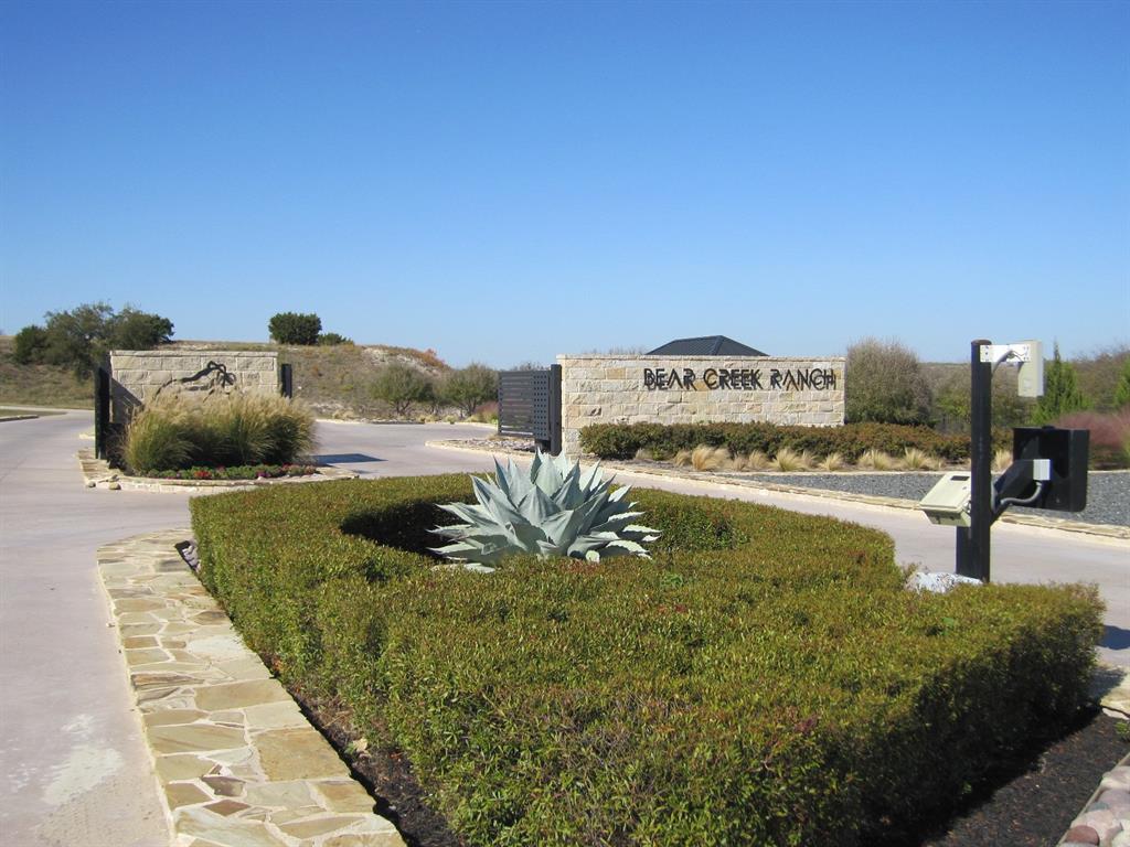 Build your dream home on this stunning 4.0 acre estate lot, offering panoramic views of Fort Worth and breathtaking sunrises & sunsets. Located in an exclusive gated community in Parker County!  Steps away from the historic Moncrief Ranch!  This site combines natural beauty, privacy & flexibility with NO CITY TAXES  but award-winning Aledo ISD.  Your choice of any customer builder and NO TIMEFRAME to build.  Minimum living space is 3,500 square feet, 90% exterior masonry.  HOA approval required.  Private water wells & septic systems eliminate water bills.  Tri-County Electric and buried propane tanks allowed. This site offers the space, views, and amenities to make your dream a reality.  Experience the perfect blend of rural charm & upscale living with easy access to Fort Worth & the Metroplex.  Contact me today to secure your piece of Texas paradise!