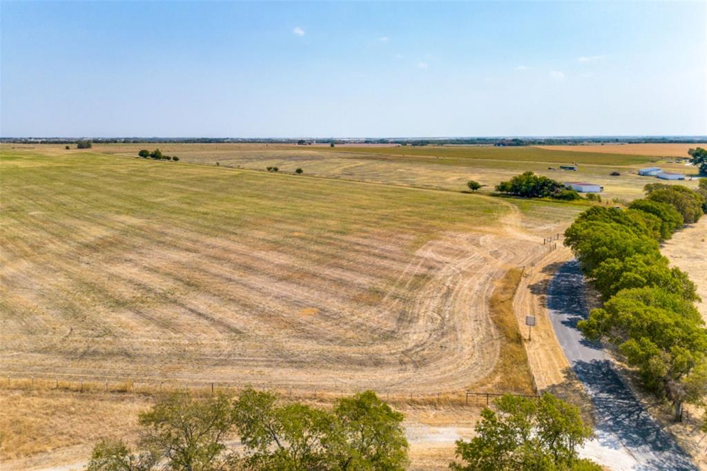 Big Onion Creek Ranch is currently operating as an active hay farm and is primed for future development. This partially fenced 225 +- Acre tract is located approximately 0.6 miles east of HWY 77 and only 1 mile east of Interstate 35. The ranch is already surrounded on all four sides by large lot single home developments and is positioned within a major growth corridor. Approximately 60 acres of the ranch is made up of improved Bermuda grass and the remainder is under no-till cultivation with Haygrazer. The entire property is under a 1-D-1 agricultural tax exemption, creating an excellent investment opportunity into an income-producing asset with immediate or future development potential.