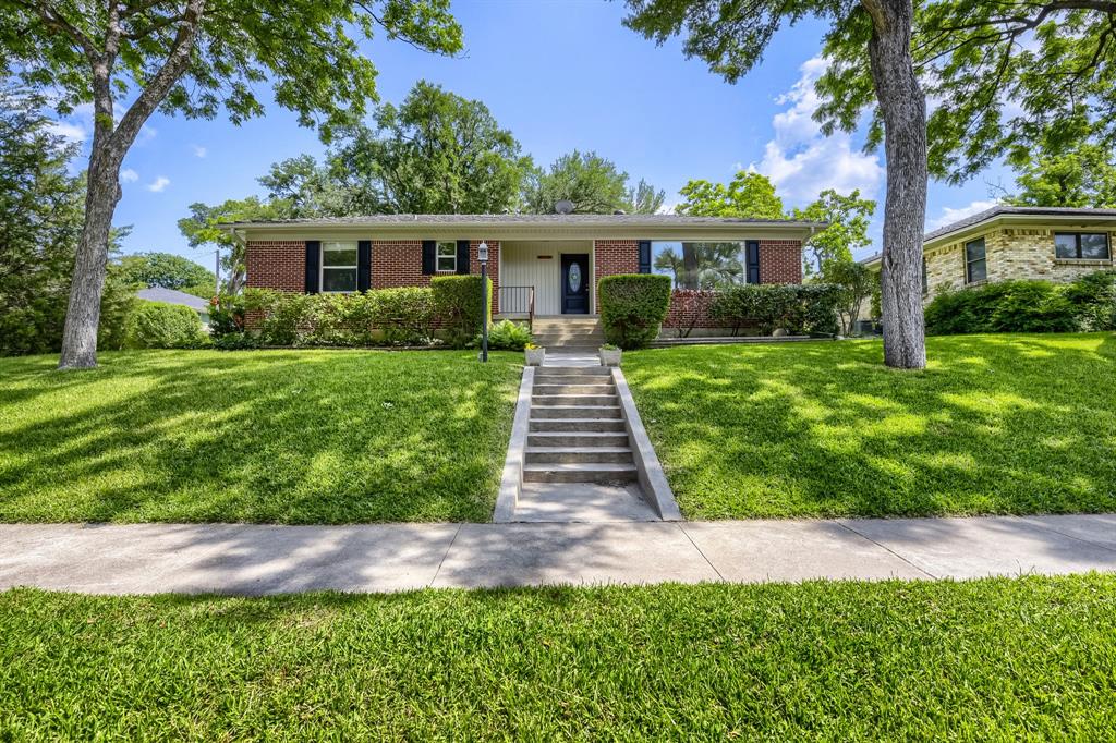 Seller offering up to 2.5% in seller credits to use towards rate buy down or closing costs with preferred lender. Beautiful Grand Lochwood home set on a large corner lot facing the greenbelt. This spacious property offers generous room sizes with natural light and views from nearly every window. Updates include the kitchen, windows, Trane HVAC system, and a lifetime steel roof, plus a pleasant sunroom for year-round enjoyment. Original 1958 red oak hardwood floors lie beneath the carpet, ready to be revealed. The home also features a large 2-car garage, carport, and an additional driveway and yard area. With a 485 sq. ft. garage and a beautifully manicured lot with mature trees, this well-kept home is already lovely—and even more stunning with your personal touches.