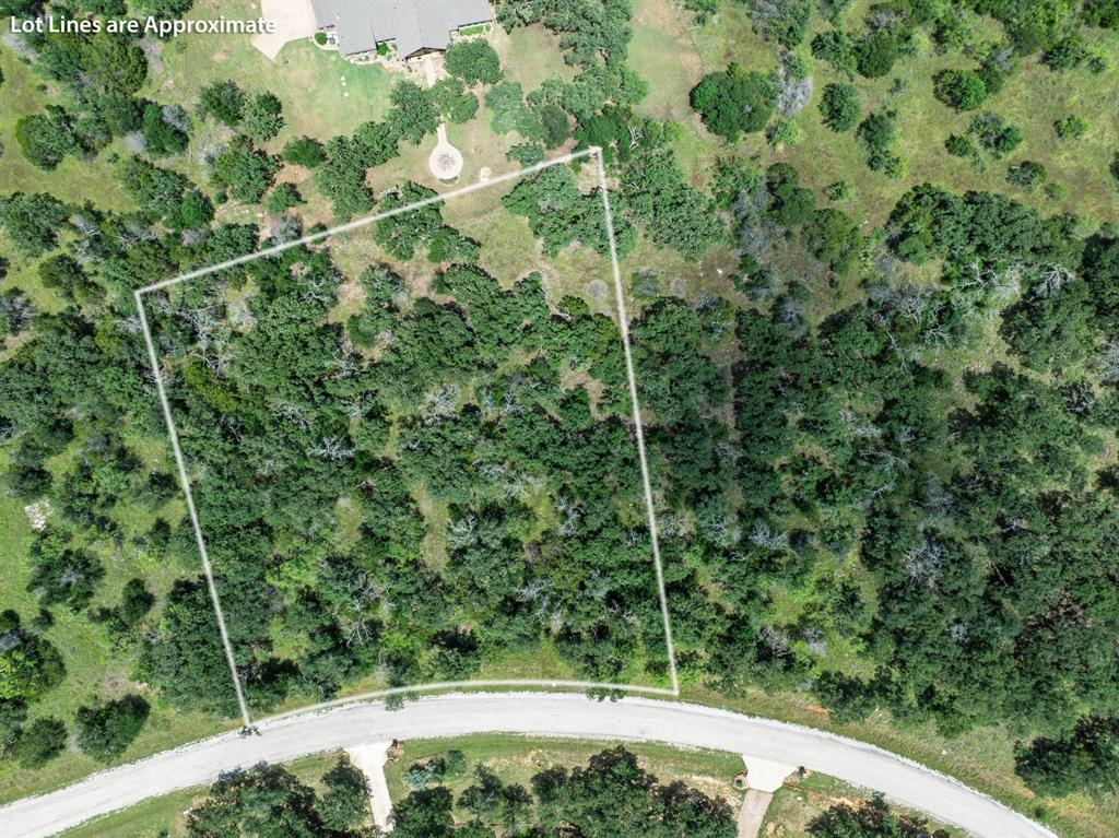 PRICE DROP! Nestled in the serene countryside just minutes from Gordon, Texas, this 1.295-acre parcel at 7-R Ranch offers a rare opportunity to own a piece of Texas tranquility. Whether you're seeking a weekend getaway or a place to build your dream home, this land provides the perfect canvas for your vision. Property owners enjoy access to an abundant list of facilities including the Arthur L Ruff Center swimming pool and workout center; fishing and boating on Lake McIntyre, hiking trails, stunning views and scenery, and frequent spotting of wildlife, just to name a few. Come check out this incredible homesite, the community amenities and all Palo Pinto County has to offer out west of DFW!
