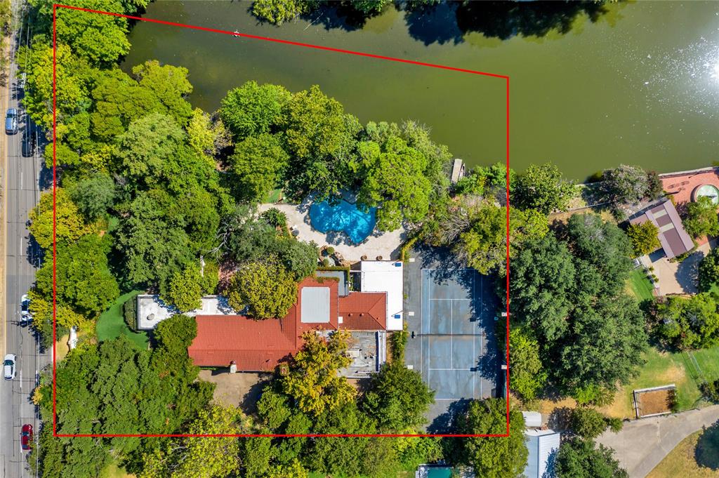 This prime property, located in the prestigious Preston Hollow neighborhood of Dallas, presents a rare opportunity for custom construction on a spacious 1.41-acre gated estate lot situated on a private lake. This exclusive estate lot is nestled amidst a lush landscape of mature trees, creating a tranquil and picturesque setting for a dream estate tailored to your preferences.

Access to this exceptional property is granted through two secure gates, ensuring both convenience and security for its future residents. The existing home is considered to have no value and will not be available for viewing. The true value of this offering lies in the extraordinary land and its serene surroundings.

Centrally located on the prestigious Preston Road, this property enjoys a prime position in the heart of Preston Hollow. Its proximity to the private school corridor, as well as Dallas' finest shopping and dining establishments, adds to the desirability of this location.