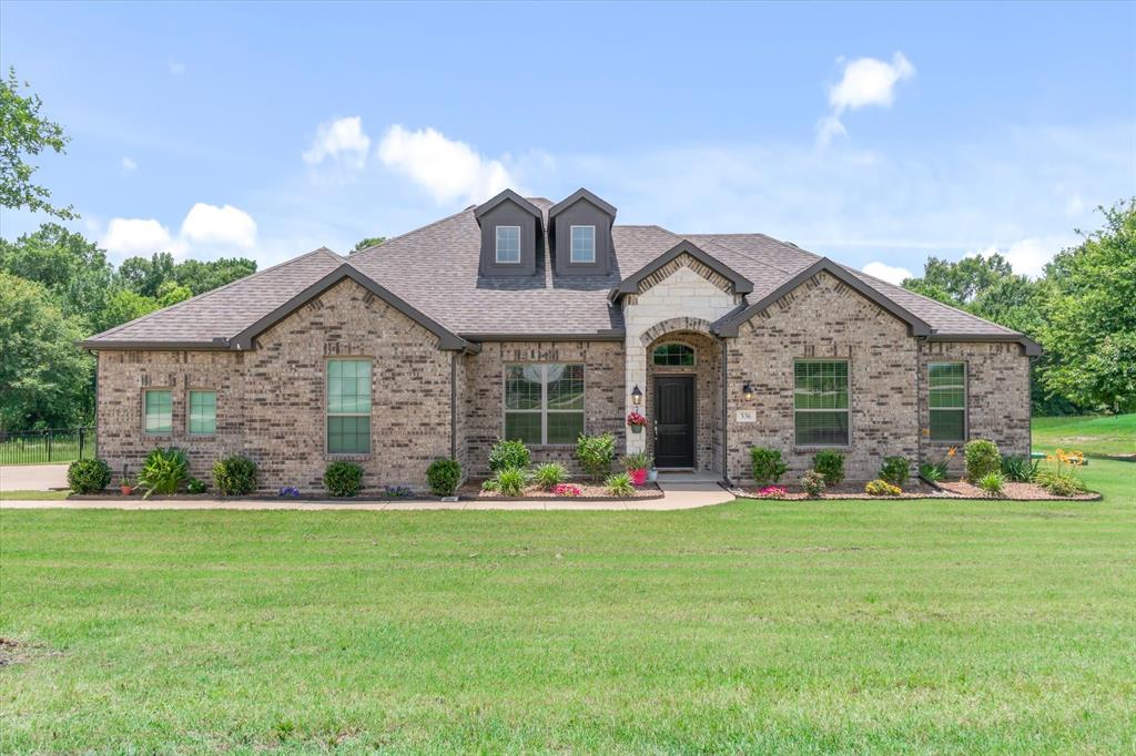 Welcome Home to this beautiful 4-bedroom, 2-bathroom home situated on 1.18 acres in the highly sought after Edgewood ISD!!! Built in 2022, this move-in-ready home offers 2,118 square feet of thoughtfully designed living space with up - to - date finishes & an open floor plan. Step inside and you're greeted by a wide entry hallway and on the left is a versatile flex room that would make the perfect home office, workout room, playroom, or second living area. Luxury vinyl flooring flows throughout the home, while large windows fill every room with an abundance of natural light.
The spacious living room features a charming shiplap fireplace that serves as the focal point of the home. The bright and inviting kitchen is perfect for everyday living, offering a large island, gas cooktop & ample counter space. The dining area is conveniently located just off the kitchen, creating the ideal space for slow mornings with coffee or pizza and game night. The split-bedroom layout provides privacy for everyone. The primary bedroom is spacious with an oversized bathroom complete with dual vanities, a large walk-in shower, and a large walk-in closet. 
The other side of the house has 3 bedrooms with high ceilings, big windows and roomy closets. 
Outside is where this property truly shines! The adorable exterior, beautifully maintained yard, and oversized backyard create a setting that's hard to find. Mature woods along the back of the property provide shade, privacy, and a peaceful backdrop, making the yard feel much larger. Located in a friendly neighborhood where kids ride bikes, evening walks are part of everyday life, and neighbors are not too close. You'll love the convenient location just minutes from Edgewood Schools, a coffee shop, cafe & feed store. Highway 19 is a hop, skip & jump away providing easy access to I-20, and nearby towns Canton, Grand Saline, and Emory. Don't miss your chance to be located out of the city limits but only 2 miles from town!!!!