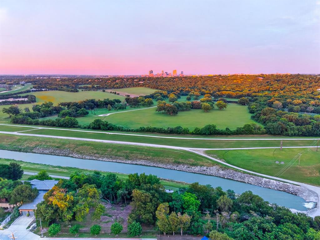 Positioned along the iconic Fort Worth Trinity River with over 340 feet of prized river frontage, this exceptional riverfront property presents a rare opportunity to create a legacy estate, luxury retreat, or multi-dwelling compound in one of Fort Worth’s most breathtaking natural settings. Framed by mature trees and panoramic views of the Trinity River, Downtown Fort Worth, and unforgettable Texas sunrises and sunsets, the property offers a remarkable blend of privacy, beauty, and convenience.



Designed for buyers searching for Fort Worth riverfront property, Trinity River land for sale, luxury homesites, Texas waterfront land, or development opportunities near Downtown Fort Worth, this one-of-a-kind offering provides direct trail access and endless possibilities for a custom dream home or multiple residences. Bring your own builder or take advantage of the owner’s architectural plans thoughtfully designed by a renowned architect to fully capture the surrounding landscape and elevated river views.



Whether envisioning a modern luxury estate, private family compound, or architecturally significant retreat, this property delivers an extraordinary canvas in the heart of Fort Worth. Enjoy the serenity of riverfront living while remaining moments from Downtown Fort Worth, the Cultural District, Clearfork, Trinity Trails, dining, entertainment, and premier shopping. Opportunities of this scale, frontage, and location along the Trinity River are exceptionally rare.