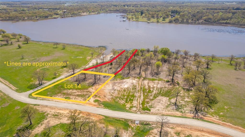Waterfront Lot in The Retreat at Anglers Point in Emory on Lake Fork! Build your dream waterfront home in The Retreat at Anglers Point, one of Lake Fork’s newest and most exciting subdivisions. This elevated waterfront lot offers beautiful lake views, wide open spaces, and a peaceful natural setting. The approximately .75-acre deeded lot, combined with 0.47 acres of SRA leaseback, provides the perfect canvas for your custom lake retreat. Mature trees are scattered throughout the property, and the gently sloping terrain leads directly to Lake Fork, allowing for the opportunity to build your own pier and boathouse. Utilities are available, making this property ready for your vision. Lake Fork is nationally known for its world-class fishing, yet this location also offers the tranquility of waterfront living—ideal as a weekend getaway or full-time residence. Convenient access from the Dallas–Fort Worth area and close proximity to nearby communities with restaurants, shopping, and entertainment make this an exceptional opportunity. A true waterfront gem in a subdivision destined to be a standout—don’t miss your chance to secure a piece of Lake Fork living.