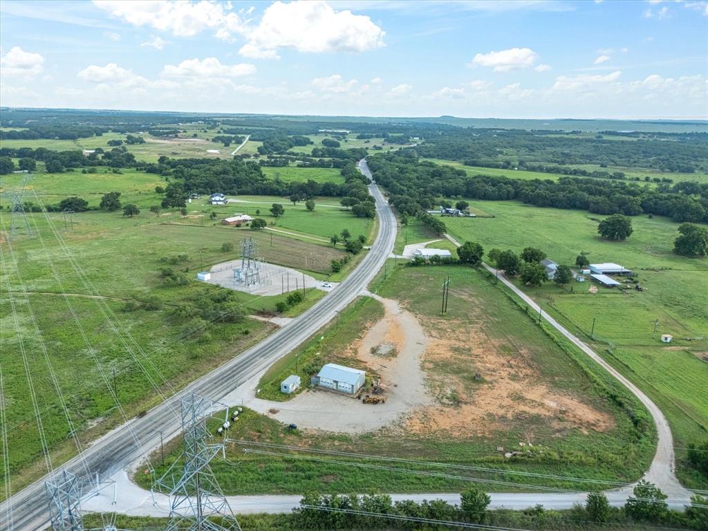 Commercial Land Opportunity Just South of Bowie, TX. 3.83 acres conveniently located right off the highway. Has a 41.7' x 27.6' Metal shop with roll up doors. Call me for a showing today!