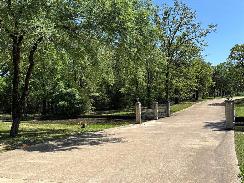 Nestled in one of the most highly rated subdivisions on Lake Fork, this beautiful lot in Royal Oak Estates offers the perfect blend of serenity, luxury, and convenience.  Located near the lake and surrounded by mature trees, the property promised peace and privacy in a well-maintained community. There is a 2500 SF minimum to build but no time frame restriction.  Royal Oak Estates features secure, gated entrance (open daily from 7 AM to 6 PM), concrete streets, a private community boat ramp, and close proximity to State Highway 515, providing easy access to the lake's main thoroughfare and nearby amenities.