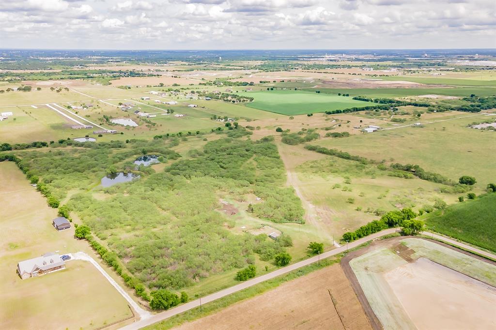 Discover the possibilities with this exceptional 44.05-acre tract of unimproved ranch land in Joshua, Texas, slated for Godley ISD. Whether you're dreaming of building your forever country estate, creating a private ranch retreat, or seeking a prime investment opportunity, this property offers endless potential. Featuring two stock tanks and expansive open space, the land provides the perfect canvas for a custom home, livestock, recreation, or future development. A current agricultural exemption is already in place, offering valuable tax benefits, and with no city taxes currently assessed, this property presents an even more attractive opportunity. With its desirable location and abundant acreage, this property is truly a developer’s dream—offering the rare combination of country living, investment appeal, and room to bring your vision to life. Don’t miss the chance to own a remarkable piece of Texas land with unlimited possibilities.