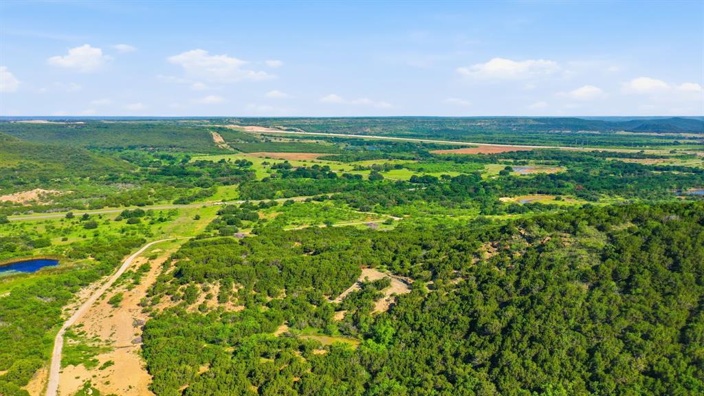 Beautiful 34.5-acre tract offering the perfect setting to build your dream home in the country! This scenic property features an abundance of mature cedar trees that provide privacy, shade, and a peaceful natural setting. Build your dream home on a hill with amazing views all around!

Whether you’re looking for a quiet place to build a permanent residence, weekend retreat, or recreational getaway, this property offers endless possibilities.

Utilities are conveniently available within the development, including electricity and water, though they have not yet been extended directly to the individual tracts. Conveniently located approximately 42 miles from Weatherford, 18 miles from Eastland, 32 miles from Stephenville, and 69 miles from Abilene, this property offers the peace of country living while still being within easy driving distance of shopping, dining, and other amenities.

With a beautiful combination of trees, privacy, and views, this property is a rare opportunity to own your own slice of Texas countryside.