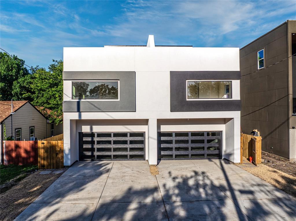 Modern design meets urban convenience in this stunning three-story duplex located just minutes from the heart of Dallas. This spacious 4-bedroom, 2.5-bath home features an open-concept layout with soaring ceilings, abundant natural light, and designer finishes throughout. The chef-inspired kitchen showcases custom cabinetry, quartz countertops, a farmhouse sink, stylish backsplash, and a large island overlooking the expansive living area—perfect for entertaining. Upstairs, you'll find generously sized secondary bedrooms and a private primary retreat complete with a spa-like bath and walk-in closet. The third floor offers a versatile bonus room and an incredible rooftop terrace with breathtaking views of the Dallas skyline—ideal for relaxing, entertaining, or enjoying evening sunsets. Conveniently located near Bishop Arts District, Trinity Groves, Downtown Dallas, Deep Ellum, and the Dallas Medical District, with easy access to major highways, dining, shopping, and entertainment. Experience modern city living at its finest.