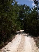 Heavily wooded with beautiful building sites. Has a seasonal creek and spectacular views. Has a working well with a submergible pump. Outstanding location right next to the country club.
