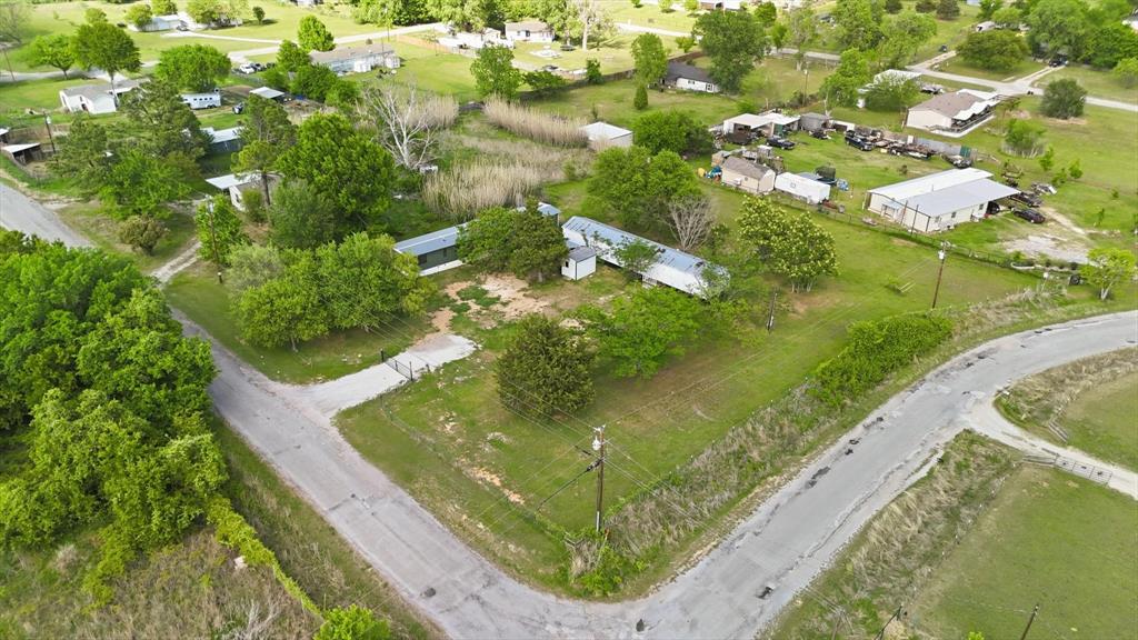 Located on a 1-acre corner lot in  Springtown, TX, this property sits outside city limits and offers a range of possibilities. With two mobile homes already on site, it’s well-suited for those looking to generate income, accommodate multiple living arrangements, or explore future development options.

The generous lot size provides plenty of room for parking, outdoor projects, or additional improvements. Existing utilities add convenience for those considering updates or new construction. Whether you’re planning to renovate, replace, or build a new home, this property offers the space and flexibility to bring your vision to life.

A great opportunity to own land with multiple potential uses in a more open, less restricted setting, while still being within a reasonable distance to local amenities. Selling AS IS!