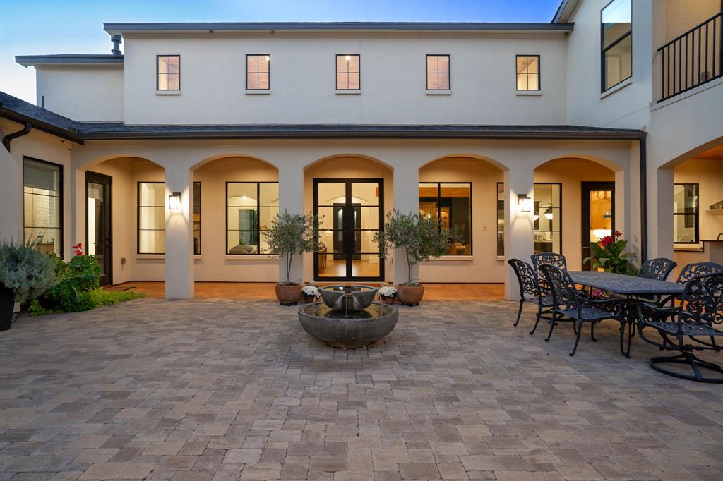 This spectacular design build by Noble Classic homes checks every box! This AG exempt 5 acre property is absolutely stunning, the 4 acre pasture is home to native pecan & fruit trees that stand over 50ft tall. Additionally,  lot includes a stocked pond and gated entrance. The full service bar inside, offers a wine refrigerator, humidor, and ice maker. The open floor plan is the perfect luxurious entertainment area, Thermador appliances in the kitchen pair perfectly with the abundance of storage the cabinets hold. The amusement doesn't stop at the bar, the outdoor living area&courtyard includes a kitchen, bar and fireplace. The master bedroom has sleek hardwood floors, a fireplace, & access to backyard. Master bathroom presents double vanities, soak-in tub & walk-in shower with oversized walk-in closet. Upstairs office has exceptional amounts of natural light with direct access to the upstairs outdoor living area. SELLER WILL PROVIDE FOR INTEREST BUY DOWN W ACCEPTABLE OFFER!!