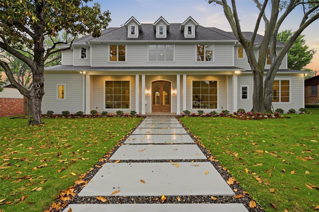 This custom Preston Hollow home blends classic Southern charm with modern farmhouse style, featuring a symmetrical façade, gabled rooflines, dormer windows, and a welcoming covered front porch framed by mature trees and a structured walkway. Inside, a bright open layout offers high ceilings, abundant natural light, and seamless flow for everyday living and entertaining. The chef’s kitchen includes professional-grade appliances, double islands, and ample storage, complemented by a butler’s pantry, wet bar, and walk in wine room. Spacious bedrooms and flexible living areas include a dedicated study, study nook for 3, and expansive upstairs retreat. The backyard is a private outdoor oasis with modern hardscaping, a pool with recessed fire-pit lounge, outdoor kitchen, and covered patio for effortless indoor-outdoor living.
