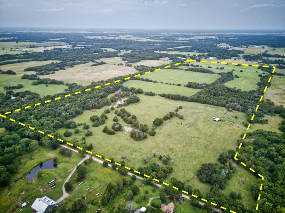 Discover the endless potential of this 157+- acres of AG-exempt property in the heart of Fannin County near the quiet town of Ravenna & Bonham TX.  This property is fenced, has a well, 2 stock ponds and sandy loam land, mixed Bermuda grass for hay & plenty of room to add your dream home.  There is county roads on 2 sides of the property with over 11,000 feet of road frontage to invest with.  The property could be broken up in 15 lots to invest with.  There is plenty of pasture for cattle. Its a short drive to restaurants, a Walmart, Hardware stores and plenty of shopping.  Electrical and water are available. Water is with White Shed Water company. Its a short drive to Lake Bonham & the new Bois d arc lake. There is plenty of deer and hog available if you want to hunt or just enjoy the view. This could be your private ranch with your dream home and barn you've always wanted.  Contact the listing agent to schedule a showing. Hope to see you soon.