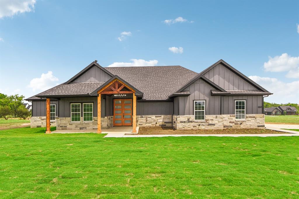 Nestled on a sprawling 2-acre lot, this stunning four-bedroom, three-bathroom home offers an open floor plan designed for modern living. The spacious interior features vaulted ceilings and custom cabinets, enhancing both style and functionality. Step outside to enjoy the covered patio and porch, perfect for entertaining or relaxing in your ample outdoor living space. This property seamlessly blends indoor and outdoor living, creating a private oasis that you’ll love to call home.
