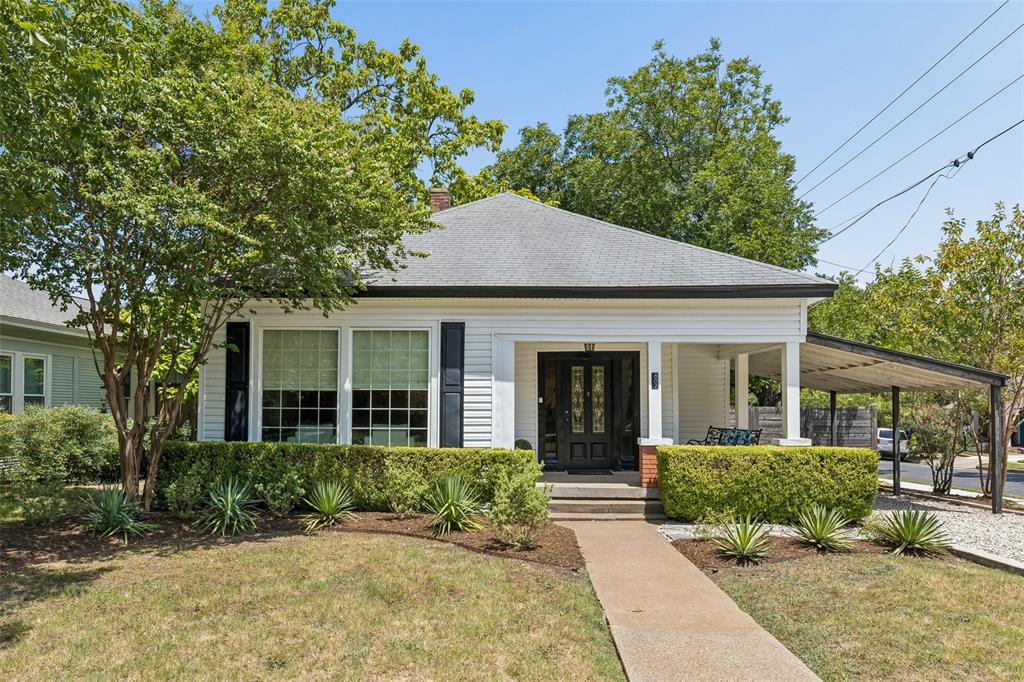 Charming bungalow lifestyle in the middle of North Oak Cliff! This neighborhood just feels good.  Sizeable covered front porch. Updated kitchen and baths. Original hardwood flooring. High ceilings. Lots of windows and natural light. Generously sized rooms. Versatile secondary bedroom. Separate utility room. Attached covered parking. Sizable backyard deck. Two patio areas. Large shade trees. Garden storage building. Large corner lot. Refreshed and ready for someone to love. Hop to TYPO and Bishop Arts for shopping, dining and entertainment. Enjoy parks, creeks, and rolling terrain.