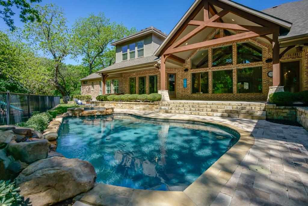 UPDATED 2024! Refinished Hardwood Floors throughout! Interior Paint! Updated Lighting! New BackSplash in Kitchen! Master Bathroom Remodel! New Carpet in Guest Suite! This Stunning Single Story Home is on a Heavily Treed 3 Acre Lot with a pool! Windows Across the Family Room with Lots of Natural Light! Open Floor Plan with Huge Kitchen, Knotty Alder Custom Cabinets with tons of storage, Endless Countertop Space with beautiful granite. Spacious Breakfast area with room for large table. Formal Dining Room, Butlers Pantry, Large Walk In Pantry and Cleaning Closet. Private Master Bedroom with Remodeled Master Bath, Walk in Shower, Freestanding Soaking Tub, Knotty Alder Custom Cabinets, Custom Knotty Alder Master Closet. Access to the Laundry from Master Closet.  Large Secondary Bedrooms each having Ensuite Bathrooms and Large Closets.  Study with Views of the Front Yard and French Door for Privacy. Guest Suite with Full Bath. Game Room or Media Room with Bar, Built In's, Storage Drawers, Game Closet and Kids Study Area! Mud Room Built In's. Half Bath For Guests. Plantation Shutters! Endless Space for Entertaining Outside with Covered Patio, Covered Outdoor Living Space with Build in Grill.  Workout room or Second Study upstairs with huge storage closet and walk out attic. Playground, Outdoor Fire Pit, Dog Run, Small Dog Room with Dog Door in Garage. 3 Car Garage. Circle Drive. So Much To See!