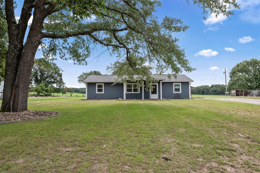 Country views, outdoor entertaining, and room to spread out! On 1 acre in Quitman, this 2-bedroom, 2-bath home offers stunning pasture views, a screened porch for relaxing evenings, and an incredible outdoor pergola with a brick fireplace that’s ready for your next gathering. Inside you’ll find fresh fixtures, granite countertops and upgraded bathroom areas. The metal shop provides extra space for projects, storage, or equipment. If you’ve been dreaming of peaceful country living with plenty of outdoor enjoyment, this is the one!