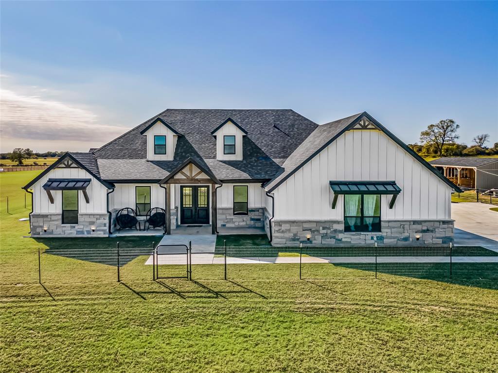 Amazing Price Drop!!! Motivated Seller!!! Welcome to your private oasis!! Stunning Will Steed custom home built in 2023 that sits on 11 AG Exempt beautiful acres,  located in Tolar, Texas. This amazing property offers both privacy and convenience and just 15 minutes from Granbury. Animal lovers will appreciate the well equipped  chicken coop and the 4 spacious 10x10 stalls for all your livestock, making this property a true sanctuary for animals. Pasture is immaculate and offers wonderful views that surround the property. This amazing property is fenced and cross fenced and level land providing both security and the freedom to enjoy the beautiful outdoors. This incredible property offers a seasonal stock tank, contributing to the beauty and functionality of the land.   Oversized three car garage and an extended driveway for well needed additional parking space. Fully sealed insulated home and condition space in the attic that is sure to reduce your utility bills. Property offers 4 bedrooms and 3 full baths perfect for families or those seeking ample space to relax and entertain. As you enter, you'll be captivated by the view and the open concept design, featuring sealed concrete floors that blend with style and durability. The heart of the home is the gourmet kitchen, complete with quartz countertops, whirlpool stainless appliances and oversized island ideal for meal prep or casual dining, and a fabulous pantry offering abundant storage. Enjoy the coffee bar with two refrigerators that convey. The living room is not just a gathering space, it features an electric fireplace, perfect for cozy evenings, while large windows invite natural light.  Explore your game room or office which overlooks the scenic landscape. The split bedroom layout ensures privacy for everyone, making it an ideal design for both family and entertaining guests. Step outside to the amazing covered back patio and take in that view.