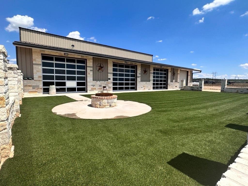 610+-acres located northeast  of San Angelo just off of Hwy 277.  The land: high hills, bottom land, heavy cover of mesquite, cedar & native brush.  High fenced,  Exotics & Whitetail convey. Several stock tanks & one small lake.  Improvements consist of a 15500 sq ft lodge, 5 bedrooms, 5 full bath, half bath, commercial style kitchen, granite & high end stainless appliances, game-living room with bar, vaulted ceiling, stone fire place. 2nd home is 3bed 2 ba, granite, carpet and tile, tray ceilings, & covered porches. 3rd home is a 3bd 2 ba, rock fireplace, addit bunk house, five separate units, bedroom & bath & lodge, kitchen & living room. The arena is  pipe with wooden inserts, pipe leadups & boxes...outdoor kitchen & bathroom completes the arena , play area for the children. Pipe working pens & approx 40 paddocks. Indoor swimming pool with rock finishes, hot tub, kitchen, fire pit & play area with turf & oversized parking area complete the ranch for family or corporate entertainment.
