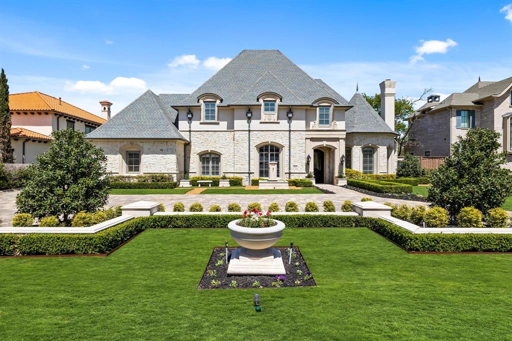 Price reduced in lieu of new roof at closing.   Fresh, light & bright! SPECTACULAR transitional French style transformed & updated. Opulent comfort with primary, guest, study,  & media DOWNSTAIRS!  Gorgeous white oak flooring just installed downstairs.  Vaulted beamed ceiling in family room, beautiful stone fireplace & stone accent wall in kitchen above commercial range provides symmetry & luxurious feel. Rare marble in kitchen with back light feature. Luxury appliances, Sub Zero & Wolf.  Expansive sliding windows lead to covered outdoor living area with automatic screens. Owner's retreat is 5 star with his & her private toliet rooms, free standing tub, & 2 large walk-in closets. Backyard has putting green, play area, pool & spa. Downstairs media room with wet bar and bath nearby. Car enthusiasts take note: separate HVAC for garage & tucked away motor court.  Wood floors throughout except media room (carpet) & baths. Walk to Preston Royal.