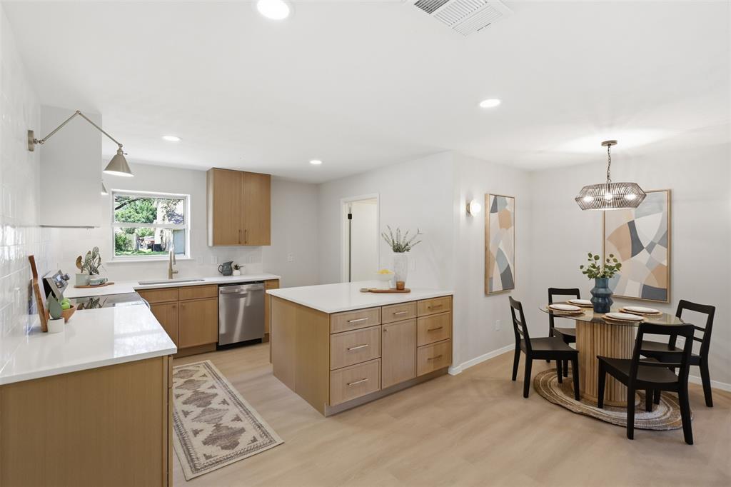 You’ll feel right at home the moment you arrive at this beautifully renovated corner lot gem! Sitting on a .3 acre lot, this 3-bedroom, 2 bath home has been thoughtfully updated with the perfect balance of modern style and everyday comfort. Inside, the home is bright and open with vaulted ceilings, fresh paint, designer lighting, and new luxury vinyl plank flooring and a cozy fireplace. The living space flows easily into the dining area and a gorgeous kitchen featuring all-new white oak cabinets, quartz countertops, and clean, modern finishes—perfect for everyday living and entertaining friends and family. The primary suite feels like a true retreat with a spa-like bathroom with white oak custom cabinetry, dual vanities, and a beautiful walk-in shower. The secondary bathroom carries the same elevated look with stylish tilework, and the additional bedrooms offer great space and storage. Out back the spacious backyard is ideal for barbecues, kids or pets at play, or unwinding under the stars. Renovated from top to bottom, this home offers the perfect mix of modern updates, timeless charm, and great curb appeal.