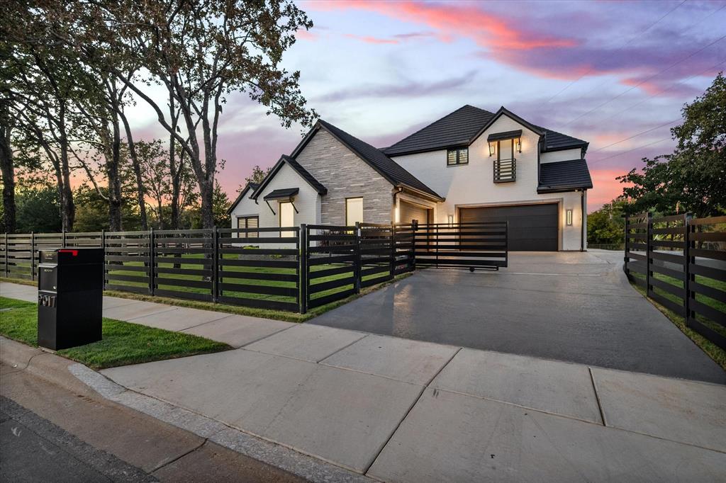 This five bedroom, six  bath, luxury estate is THE JEWEL of the mid-cities and NRH area!  Built in late 2022, this home boasts upgrades galore with elevated style and sophistication expected by today's high end buyer.
This SMART home, is systemically integrated with JOSH and complete home automation. The entire home can be controlled by a smartphone or by simply speaking commands outload.
This is a ground level living two story home; all main living areas are on the first floor with primary and two additional en suite bedrooms. Upstairs has two additional bedrooms, one studio style with sink, cabinets, mini refrigerator and Juliet balcony. Additional spacing  large enough for your gaming enthusiast, game tables, etc. 
The first floor living area opens to a beautiful custom pool surrounded by turf.  The pool area is raised and separate from the 1 acre fully irrigated zoysia grassed yard.  The entire property is fenced with JOSH AI enabled sliding front gate and separate entry parking for service providers.
Next to the main living area is the custom kitchen with 8 person quartzite dinning ledge.  The kitchen is outfitted with Thermador Professional series appliances, including gas cooktop, built in refrigerators, and Miele coffee maker.  Other main level spaces include guest suite (with sitting area and ensuite), large media room with custom 105 inch SI projector screen, cardroom, gameroom, dining room, glass-enclosed executive office, and ancillary bedroom with ensuite.
The master has a private hallway, ensuite that will exceed expectations, and oversized his, her closet with safe-room.
Additional home features include: five car garage, whole home closed cell foam insulation (all walls, ceilings, and garage have been foamed), custom floor to ceiling Napa inspired climate controlled 150+ wine cabinet, 16 surveillance cameras, whole home lighting, backup generator, Hurricane Metal Shake roof, shop style garage, and so much more!  Schedule your appt. today!