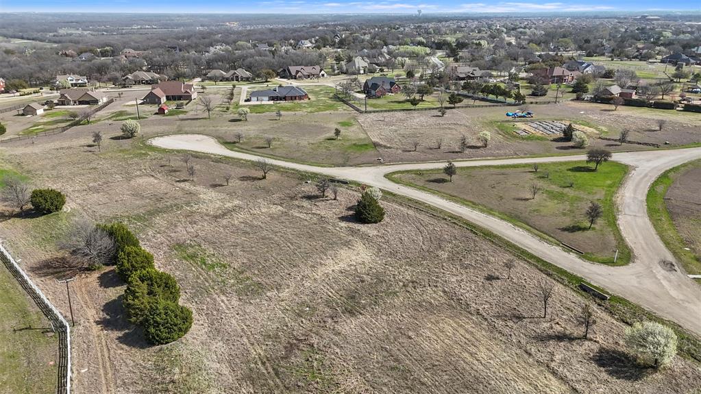 Come build your custom dream home on this spacious 1.13-acre lot located in a cul-de-sac inside of an exclusive gated community in the highly sought-after city of Melissa, TX. Offering both privacy and convenience, this premium homesite features a natural privacy tree-lined border for added seclusion while still being part of a vibrant and welcoming neighborhood. With top-rated Melissa ISD, this property provides access to exceptional schools, making it an ideal choice for families. Enjoy the best of both worlds-peaceful country-style living with an easy access to major highways, shopping, dining, and entertainment in McKinney, Allen and the greater DFW metroplex. Don't miss this rare opportunity to own a large, private lot in a premier gated community.